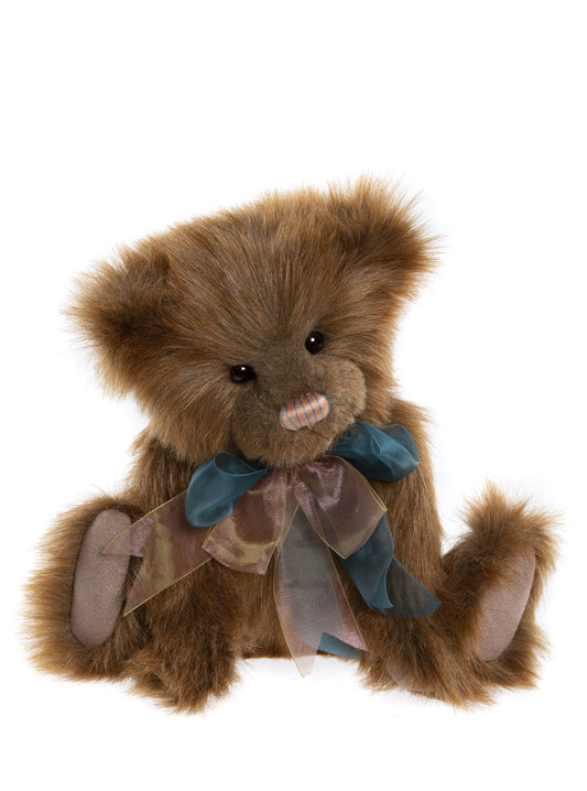 Brown plush Charlie Bear with pink and green ribbon bow and striped nose