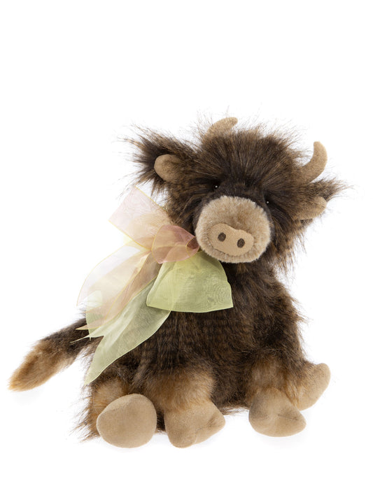 Brown plush Charlie Bear cow with yellow and pink ribbon bow